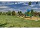 Lush neighborhood park with a colorful playground and ample green space for outdoor activities at 1531 Evening Spirit Ave, Las Vegas, NV 89183
