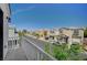 Balcony view of a neat suburban street showcasing well-maintained homes and clear blue skies above at 1531 Evening Spirit Ave, Las Vegas, NV 89183