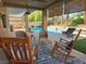 Inviting backyard patio with comfortable seating overlooking the sparkling pool at 2065 Pinion Springs Dr, Henderson, NV 89074