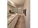Stylish bathroom featuring double sinks with granite counters and tiled flooring at 2065 Pinion Springs Dr, Henderson, NV 89074