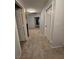 Carpeted upstairs hallway leads to multiple bedrooms at 2065 Pinion Springs Dr, Henderson, NV 89074