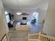 Bright and airy living room with a fireplace and view of the staircase at 2065 Pinion Springs Dr, Henderson, NV 89074