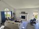 Bright living room features vaulted ceilings and a cozy fireplace at 2065 Pinion Springs Dr, Henderson, NV 89074