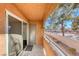 Stucco balcony with sliding glass doors, metal railing, and exterior storage closet at 211 Mission Laguna Ln # 205, Las Vegas, NV 89107