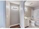 View of a bathroom with a tiled shower-tub and a vanity with sink and lighting at 211 Mission Laguna Ln # 205, Las Vegas, NV 89107