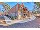 Lovely two-story condo with stucco exterior, terracotta roof, and charming balcony, surrounded by mature landscaping and walkway at 211 Mission Laguna Ln # 205, Las Vegas, NV 89107