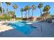 Sparkling pool with lounge chairs and nearby palm trees, perfect for relaxation at 211 Mission Laguna Ln # 205, Las Vegas, NV 89107