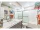 Well-lit bathroom features a spacious vanity, large mirror, and modern shower with a sleek glass enclosure at 2111 River City Dr, Laughlin, NV 89029