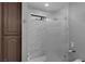 Modern bathroom shower with sleek tilework, glass doors, and neutral walls at 2111 River City Dr, Laughlin, NV 89029