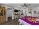 Spacious bedroom with wooden floors, closet, and decorated walls at 2111 River City Dr, Laughlin, NV 89029