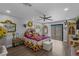Bright bedroom with a balcony, sunflower decorations and wooden floors at 2111 River City Dr, Laughlin, NV 89029