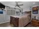 Comfortable bedroom with hardwood floors, natural lighting, and fan at 2111 River City Dr, Laughlin, NV 89029