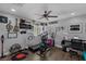Aesthetic exercise room with ceiling fan, treadmill, elliptical, and guitar decor for a motivating space at 2111 River City Dr, Laughlin, NV 89029
