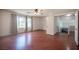 Large bedroom features hardwood floors, a ceiling fan, and access to a landing at 220 Hollyfern St, Henderson, NV 89074