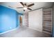 Bedroom boasts a built-in Murphy bed, shelving, and ceiling fan, maximizing space and comfort at 220 Hollyfern St, Henderson, NV 89074