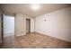 Comfortable bedroom featuring a closet and neutral tones with tiled floors at 220 Hollyfern St, Henderson, NV 89074