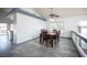 Dining area with seating for six, open layout, and access to the kitchen and backyard at 220 Hollyfern St, Henderson, NV 89074