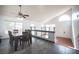 Dining area with seating for six, open layout, and steps to the living room at 220 Hollyfern St, Henderson, NV 89074