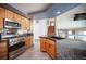 A spacious kitchen with stainless steel appliances, granite countertops, and access to living space at 220 Hollyfern St, Henderson, NV 89074