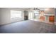 Spacious living room with fireplace, window, sliding glass door, and ceiling fan at 220 Hollyfern St, Henderson, NV 89074