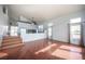 Bright living room boasting hardwood floors, large windows, and an open floor plan at 220 Hollyfern St, Henderson, NV 89074