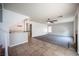 Spacious room with fireplace, wet bar, tile and carpet flooring, and lots of natural light at 220 Hollyfern St, Henderson, NV 89074