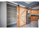 Spacious pantry with custom sliding wood door located in the kitchen at 220 Hollyfern St, Henderson, NV 89074