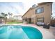 Exterior view of the pool, patio, and outdoor seating, ideal for relaxing and entertaining at 220 Hollyfern St, Henderson, NV 89074