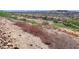 Backyard view showcases the natural desert landscape and the property's location near the golf course at 24 Via Vasari # 104, Henderson, NV 89011