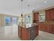 Living Room with tile flooring, island, and access to a balcony with scenic views at 24 Via Vasari # 104, Henderson, NV 89011