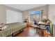 Bedroom with wood-look floors, closet with sliding doors, and natural light at 2424 Chestnut Hill St, Las Vegas, NV 89134