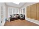 A bonus room offers a cozy seating area and natural light from a skylight above at 2424 Chestnut Hill St, Las Vegas, NV 89134
