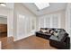 Bright bonus room offers cozy seating area, natural light, and wood flooring at 2424 Chestnut Hill St, Las Vegas, NV 89134
