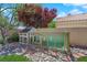 Backyard chicken coop with a run that is surrounded by river rock and red brick at 2424 Chestnut Hill St, Las Vegas, NV 89134