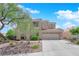Charming two-story home with a three car garage and desert landscaping at 2424 Chestnut Hill St, Las Vegas, NV 89134