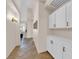 Hallway features stone floors, neutral walls, and modern lighting, leading to bright living spaces at 2424 Chestnut Hill St, Las Vegas, NV 89134