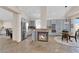Bright kitchen with blue cabinets, stainless steel appliances, and a central fireplace at 2424 Chestnut Hill St, Las Vegas, NV 89134
