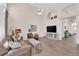 Open living room with high ceilings, stone floors, and neutral tones. Perfect for relaxing! at 2424 Chestnut Hill St, Las Vegas, NV 89134