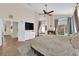 Spacious main bedroom with fireplace and backyard views, featuring a decorative ceiling fan at 2424 Chestnut Hill St, Las Vegas, NV 89134