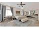 Cozy main bedroom with an area rug, large mirror, and patio access at 2424 Chestnut Hill St, Las Vegas, NV 89134