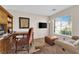 Office space with a built-in desk, comfortable seating, and a bright window at 2424 Chestnut Hill St, Las Vegas, NV 89134