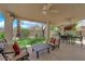 Covered patio with outdoor seating, ceiling fans, and a view of the backyard at 2424 Chestnut Hill St, Las Vegas, NV 89134
