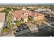 Aerial view of a desert home showcasing a well-maintained yard, tile roof, and attached three-car garage at 2548 Faiss Dr, Las Vegas, NV 89134