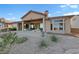 Expansive backyard patio with comfortable seating and drought-tolerant landscaping, perfect for outdoor living at 2548 Faiss Dr, Las Vegas, NV 89134