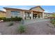 Back exterior with patio, desert landscaping, and ample sunlight at 2548 Faiss Dr, Las Vegas, NV 89134