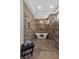 Spa-like bathroom with a soaking tub, dual shower heads, and modern finishes at 2548 Faiss Dr, Las Vegas, NV 89134
