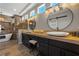 Bathroom featuring dual sinks with modern fixtures and decorative lighting at 2548 Faiss Dr, Las Vegas, NV 89134