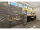Luxurious bathroom with a walk-in shower, dual sinks, and stylish fixtures at 2548 Faiss Dr, Las Vegas, NV 89134