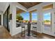 Cozy breakfast nook with a unique bar table, seating, and scenic outdoor views at 2548 Faiss Dr, Las Vegas, NV 89134