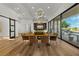 Dining area with modern lighting and a large sliding door with outdoor access at 2548 Faiss Dr, Las Vegas, NV 89134